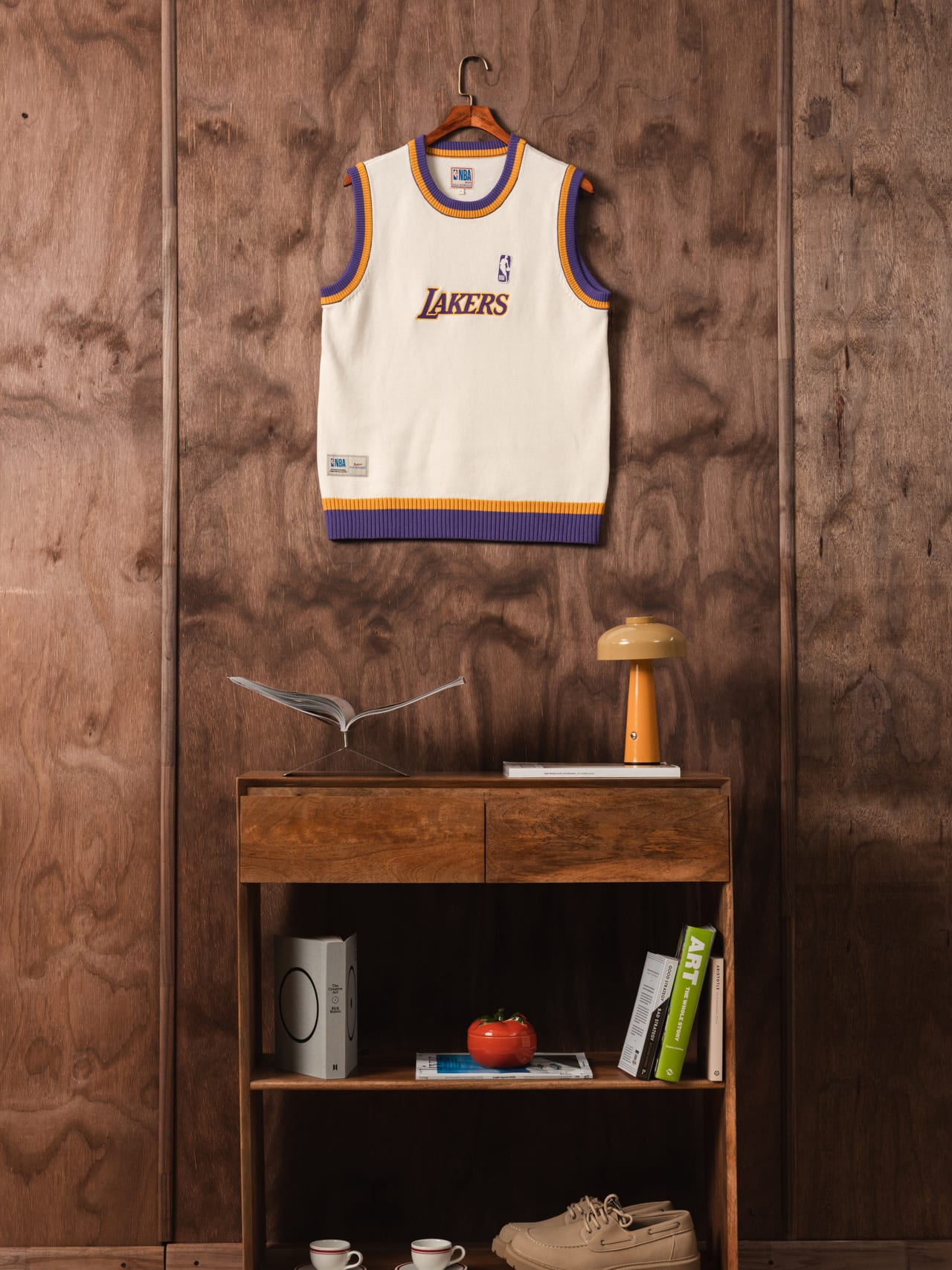 Lakers vest hanging on a wooden wall