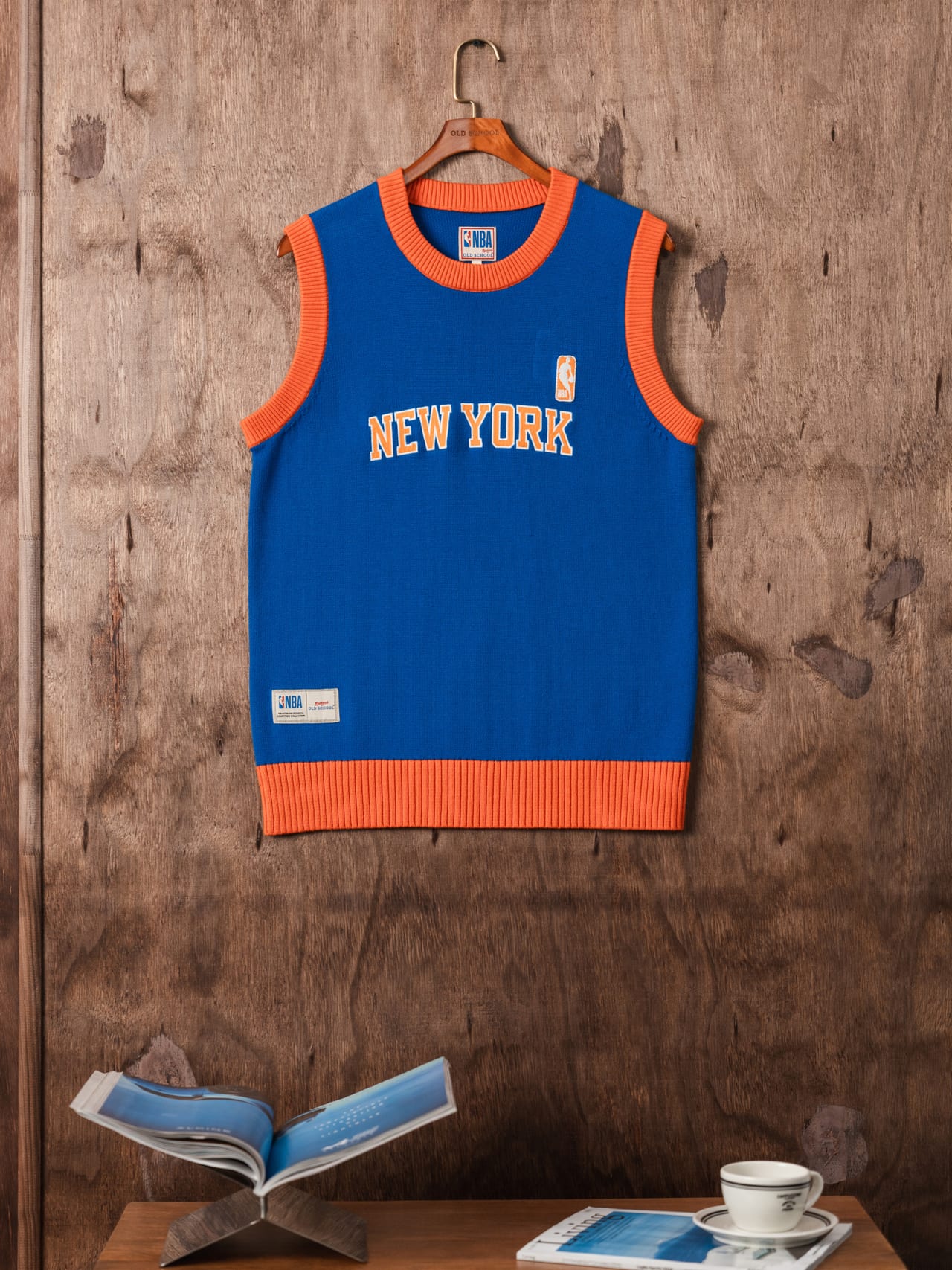 New York vest hanging on a wooden wall